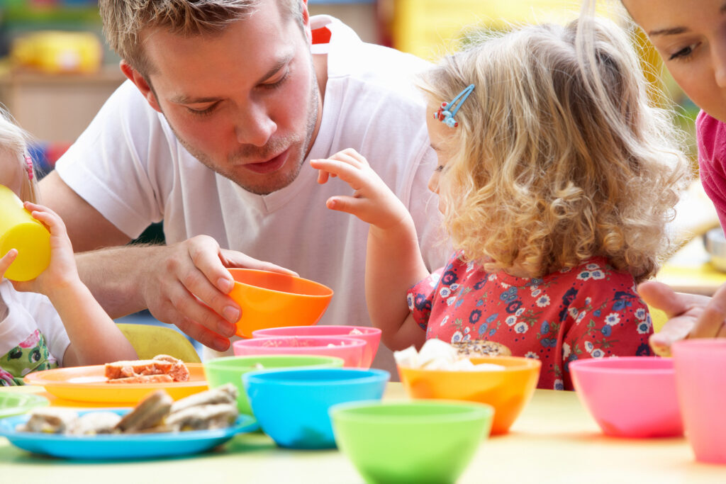 bigstock-Man-with-children-playing-toge-27386318